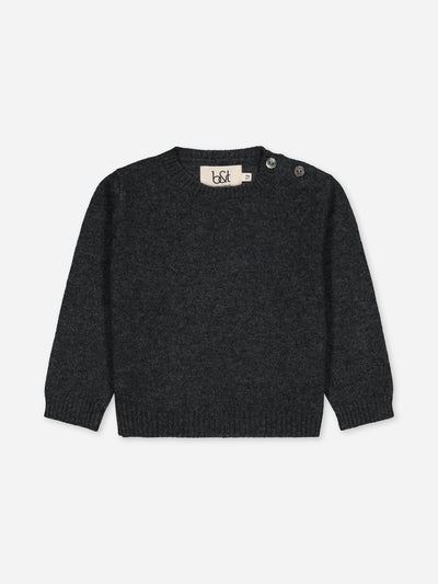 Our baby sweater in regenerated cashmere knitted in charcoal