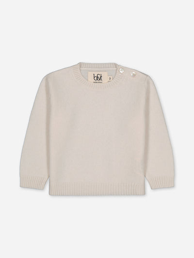 Our baby sweater in regenerated cashmere knitted in ivory